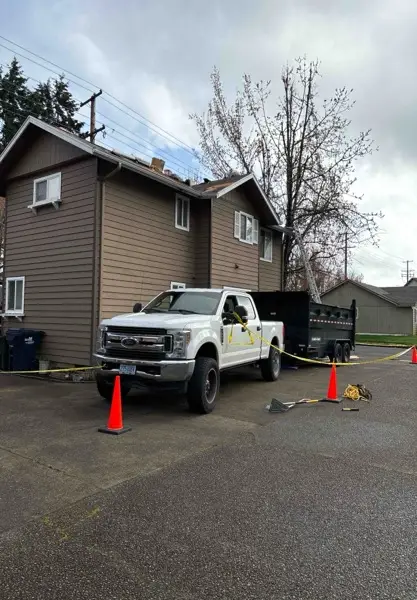 builders fixing roof