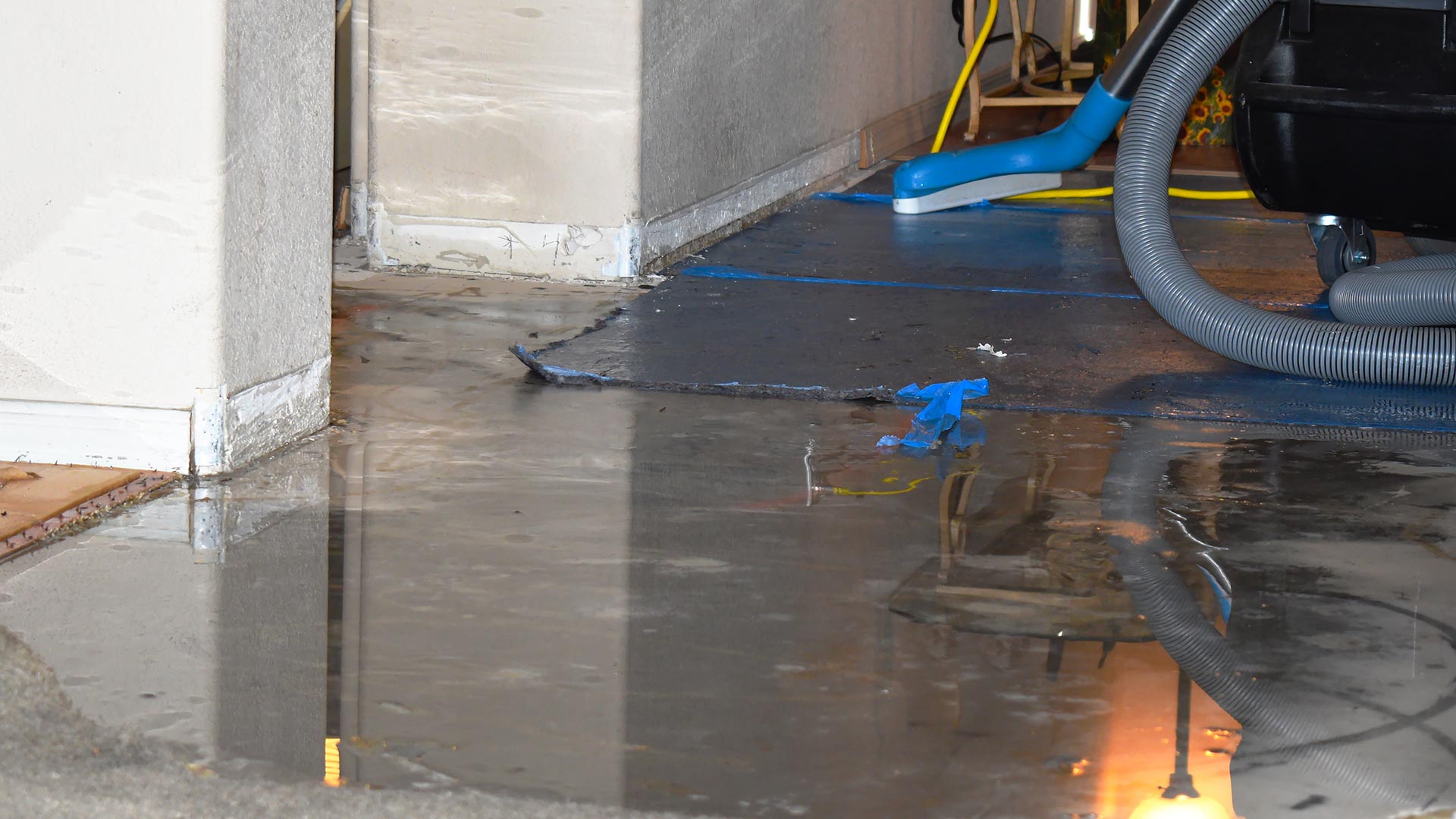 Water damage restoration equipment drying walls and flooring